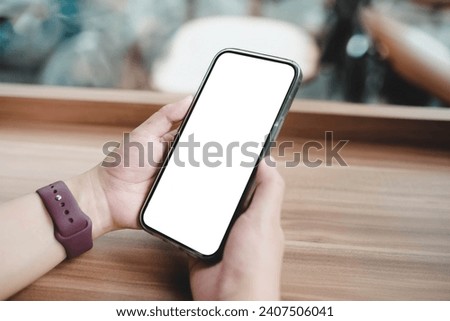 Close up of woman using cell phone,sending massages on the coffee shop.having sunbath.Phone with black screen,texting,video calls,	