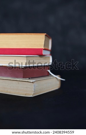 stack of books on black
