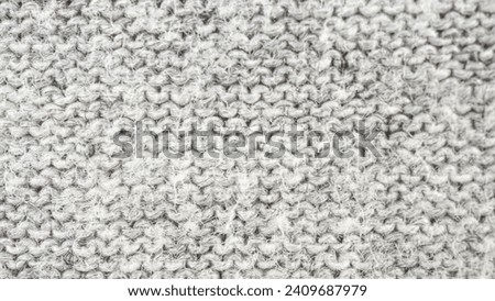 Close up abstract gray cotton texture heather background.  
Black and white texture knit fabric pattern seamless.
Selective focus.
top view.