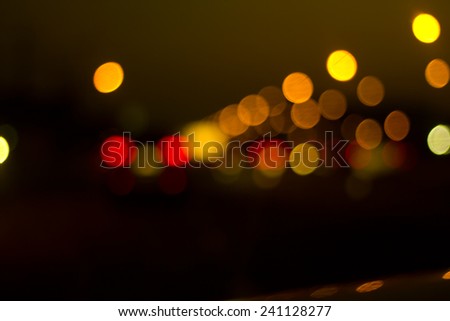 Defocused city night bokeh abstract background.
