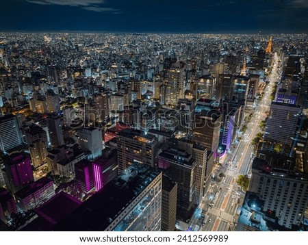 An aerial shot of Sao Paolo, Brazil at night with illumintaed buildings and streets