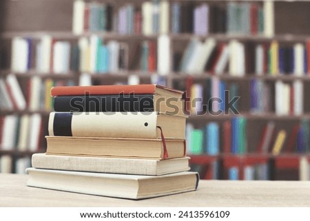 Stack of books on the table in library St Albans