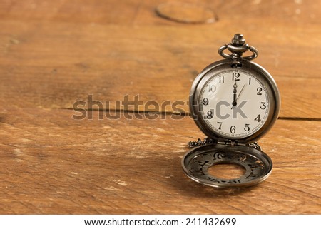 pocket watch on a vintage table