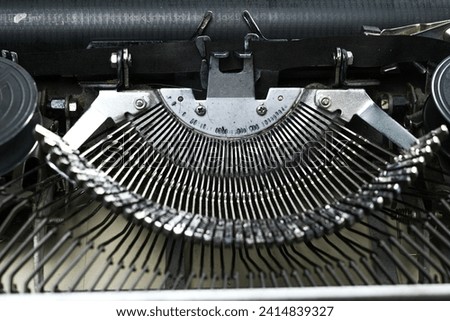 parts of a typewriter in the form of ribbons and rolls of paper which were commonly used before computers existed like today