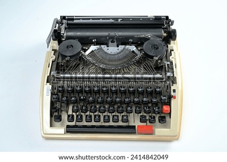A typewriter that was usually used to write letters when computers were not yet invented, like today, with a white background
