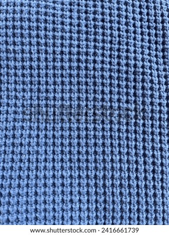 Texture of Blue Knitted Cardigan