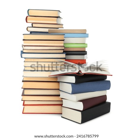 Stacks of different books isolated on white
