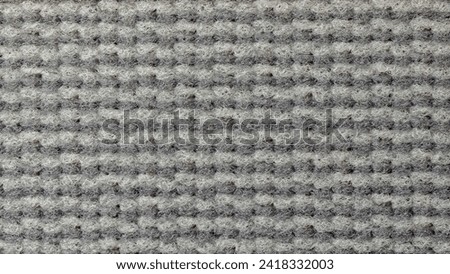 Close up of soft and warm grey fabric. Background for graphics.