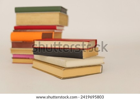 Stack of books on white backgrounda education school library