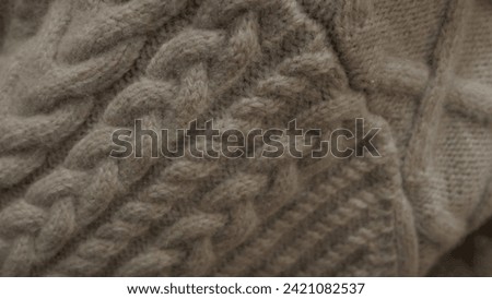 A dull-colored yarn with a fibrous texture.