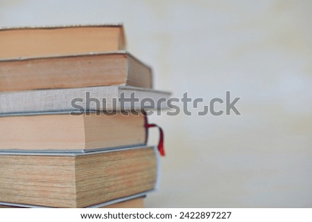 Books for studying on a yellow background