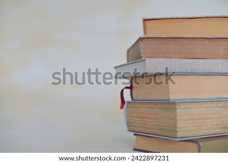 Books for studying on a yellow background