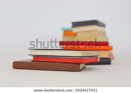 Stack of books on white education