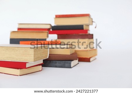 books in the shape of a heart on a white background