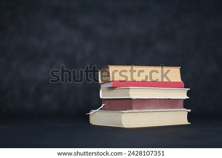 Stack of books on black background. Very nice photo of books.Illustration for books, school, study, library, science