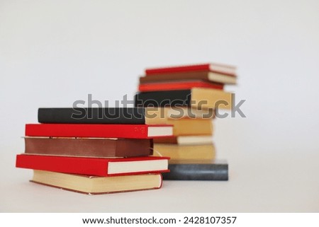 books in the shape of a heart on a white background