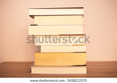 Several old books on top of each other