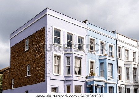Traditional houses in Notting Hill neighborhood in London. Colorful pastel houses