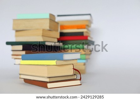 pile of books on white background.