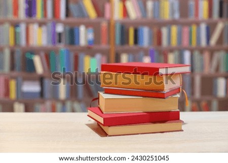 books with wooden shelves on table in library