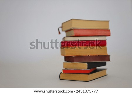 stack of books on white background, close up view
