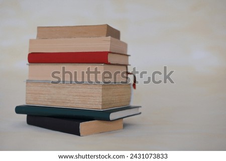 A collection of history books and encyclopedias on a yellow background
