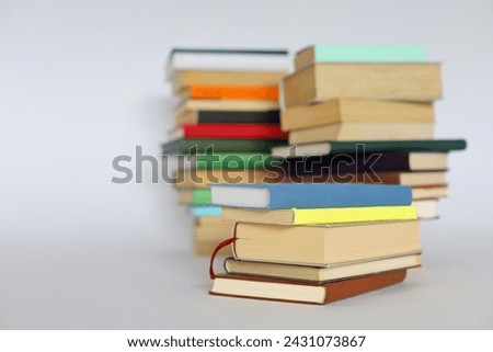 pile of books on white background.