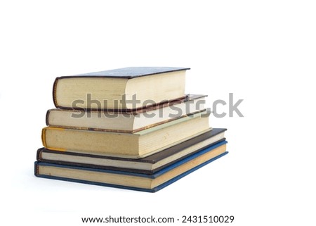 Pile of used books isolated on white background. World book day.