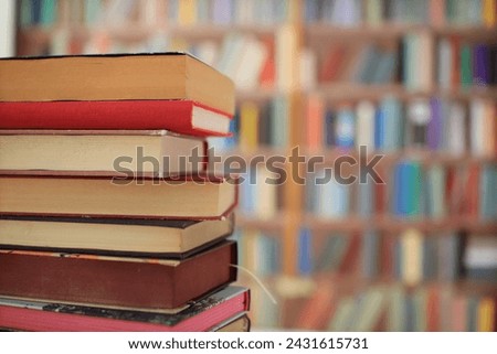 many colorful books on the shelf in the library