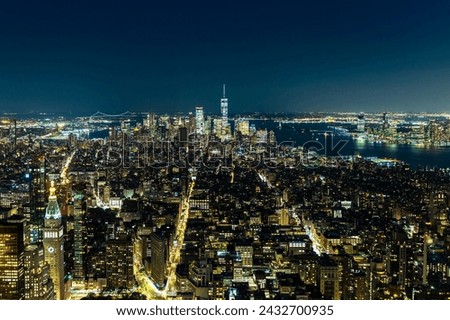 Panoramic aerial view of Manhattan at night in New York City, NY, USA