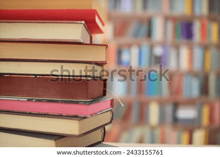 many colorful books on the shelf in the library, Books by the world's best writers, bestsellers