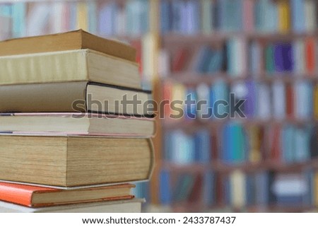 books on the table in library of university,Books on the table, library, school, education, pupil, student, encyclopedia, knowledge, learning, brown book,
​