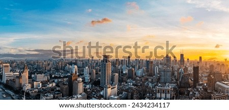 Aerial view of Shanghai city skyline and skyscrapers scenery at sunset. Famous city landmarks in Shanghai. Panoramic view.