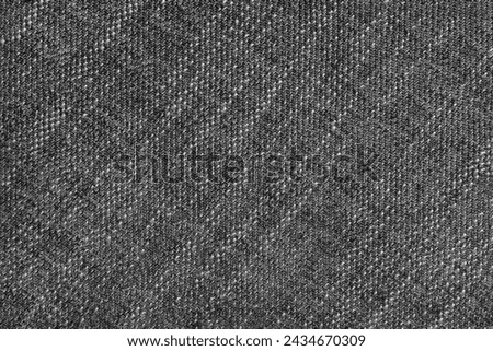 Coarse weave jacquard fabric texture background, black cloth texture. Textile background, furniture textile material, wallpaper, backdrop. Textile structure close up.