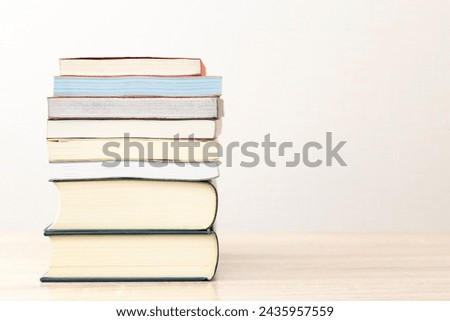 Books stacked on the desk.