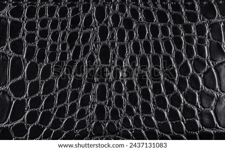 Black crocodile Leather background and texture.