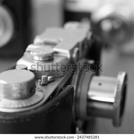 Vintage camera close up. Black and white photo with selective focus.