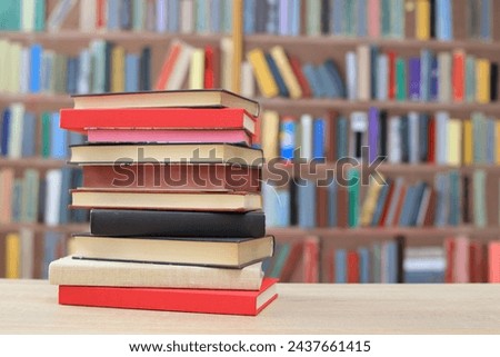 books and stack on wooden shelves in library
