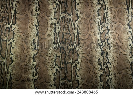 texture of print fabric stripes snake for background, closeup