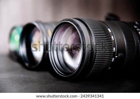 close-up of a camera lens on a black background with shallow depth of field