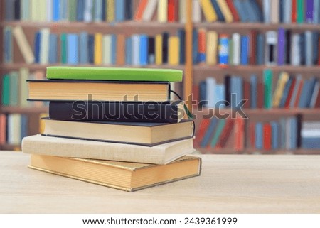 books and stack on wooden shelves in library