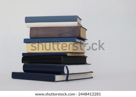Stack of books on white background, nice books to read, afternoons resting, books for the beach, studying