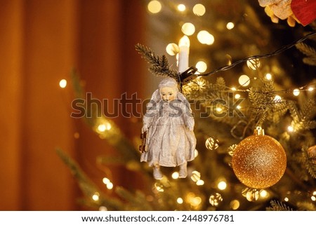 homemade vintage doll hanging on the Christmas tree