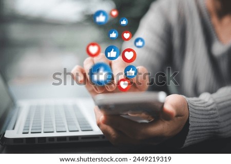 Person used their smartphone to comment, like posts on social media, embracing digital technology that enables live interaction on mobile phones. comment phone, technology digital social media concept