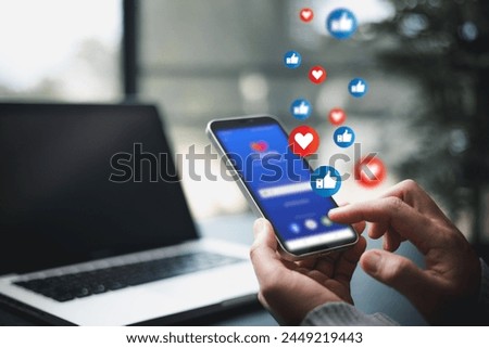 Person used their smartphone to comment, like posts on social media, embracing digital technology that enables live interaction on mobile phones. comment phone, technology digital social media concept