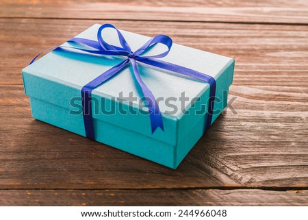 Gift box on wood background 