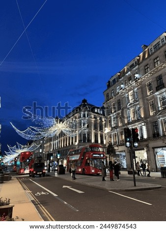 Christmas lights in London with classic red bus 