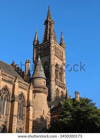 Glasgow University Tower Scotland, United Kingdom. The most recognizable place in Glasgow. The tower is illuminated by the rays of the sun.