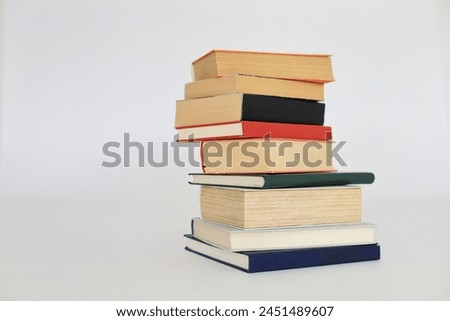  books, hardback book, bright colorful wooden table, back to school. copy space for text, education, school and business concept.