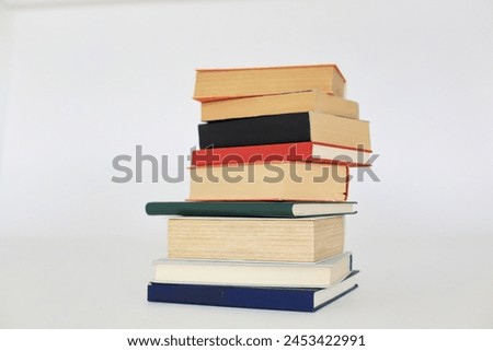  books, hardback book, bright colorful wooden table, back to school. copy space for text, education, school and business concept.